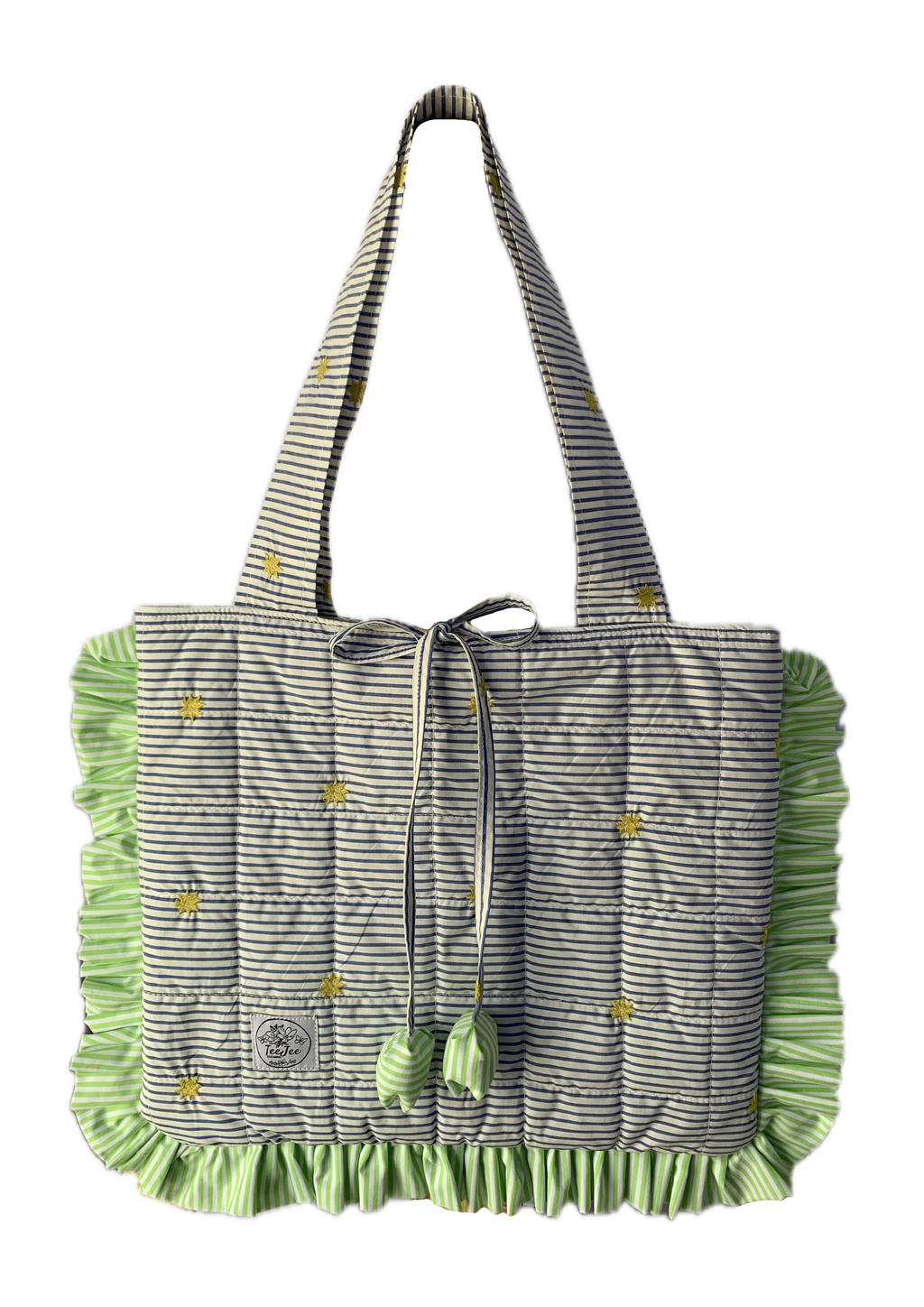 A quilted tote bag with a gray and white striped pattern, and light green ruffled trim.