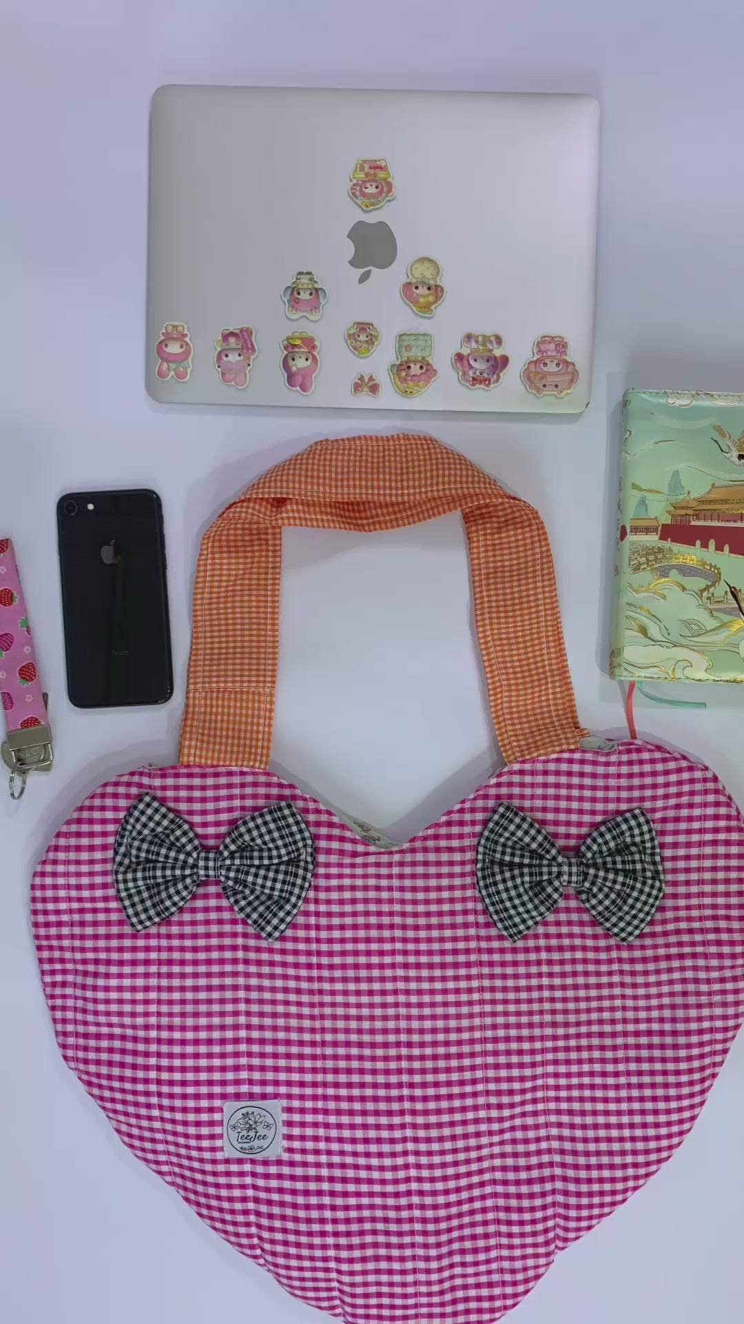 The tote bags has enough space for laptop, iphone, notebook and daily essentials. 